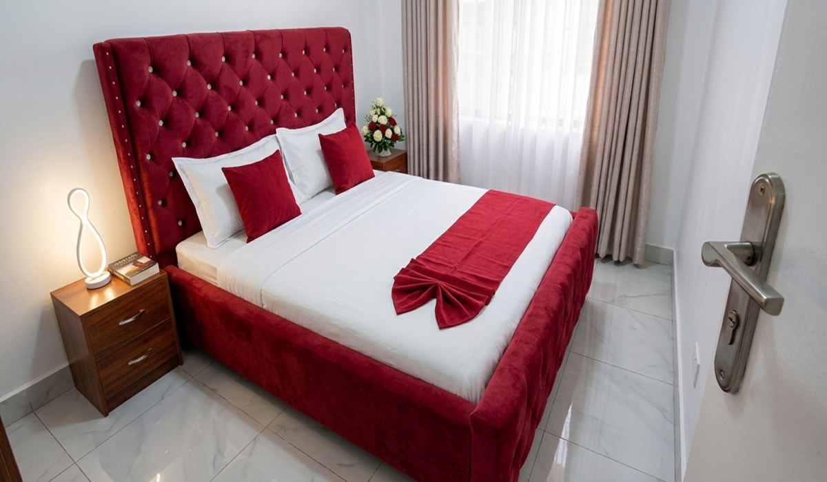Deluxe bedroom suite with premium bedding and warm natural lighting